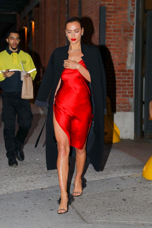 EXCLUSIVE: Irina Shayk showcases her long legs in a red satin dress while leaving a Photoshoot in Ne