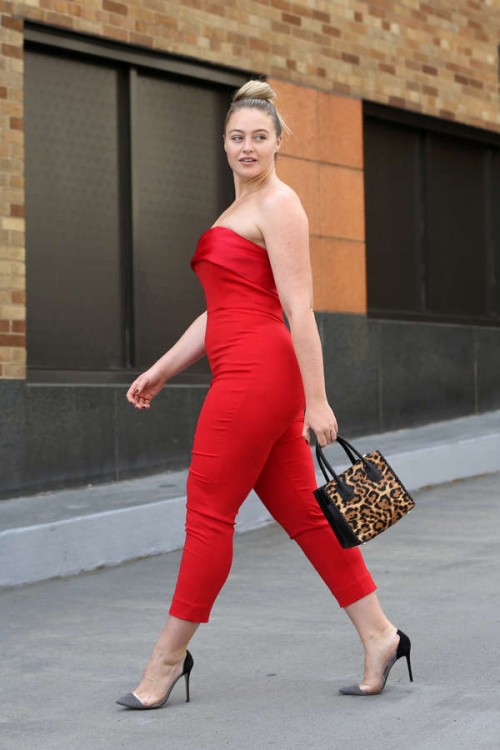 Model Iskra Lawrence, wearing a red jumpsuit, attends Badgley Mischka S/S 2018 at Skylight Clarkson 