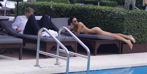 Kendall Jenner takes a dip in the pool in the hot sun as she relaxes pool side with Fai Khadra at he